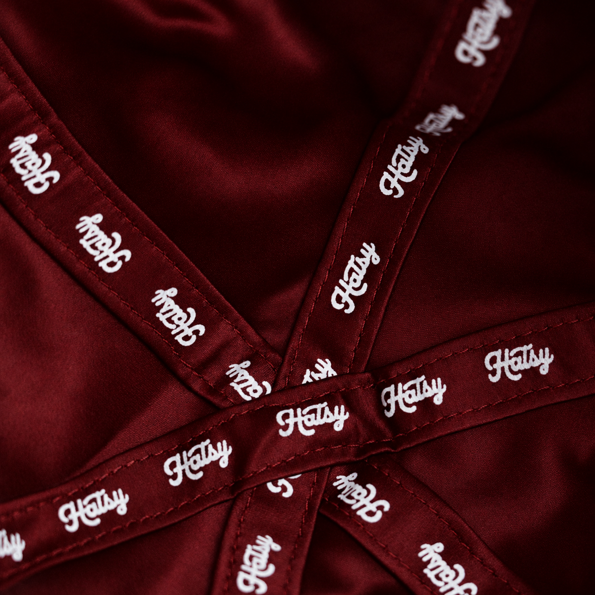 Close-up of the HATSY silk lining in burgundy